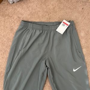 Men’s Nike Dri-Fit AthleticPants. Bottom side zippers. NWT. Large.